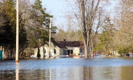 Image of a house surrounded by flood water